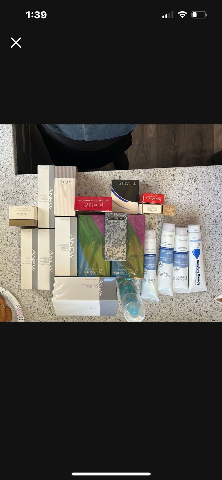 20 brand new Avon products, including colognes perfumes