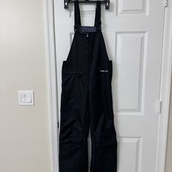 Kids size medium Arctix ski/snowboard bibs like new condition in Weston