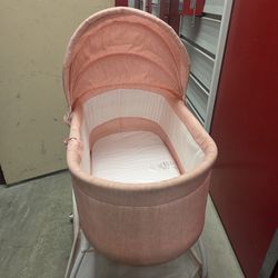 Pink baby bassinet
