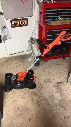 Corded electric trimmer,  edger and mower