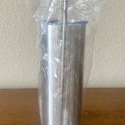 24oz Stainless Steel Tapered Tumbler with a lid, a straw, and a cleaning brush for the straw.