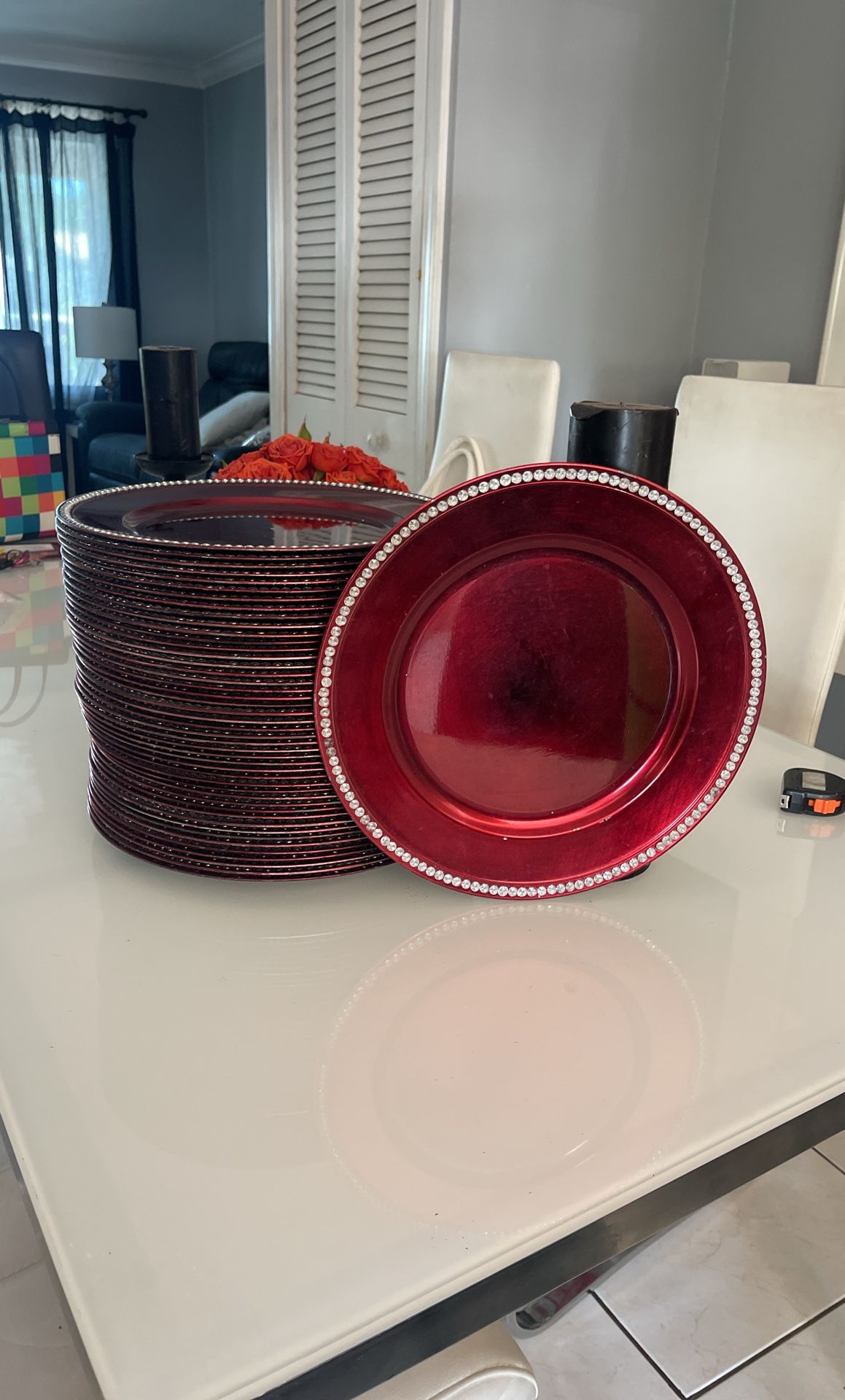 Red charger plates with rhinestone trimming