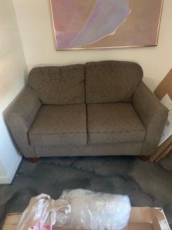 Gray fabric two seater couch