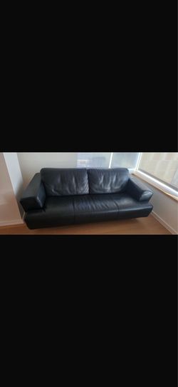 2 Black leather sofas