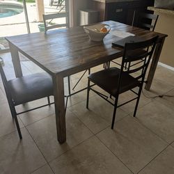 Sturdy wooden kitchen table with chairs