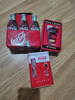 Collectible Coca-Cola metal tins