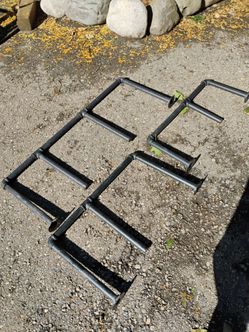 Eight racks for hanging items in the garage