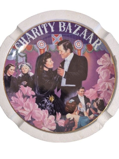 Celebrate the timeless romance of Gone With the Wind with this elegant musical collector plate, titled "The Charity Bazaar" from the Musical Treasure