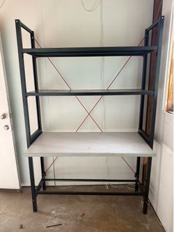 Metal shelving unit w/adjustable mid-section