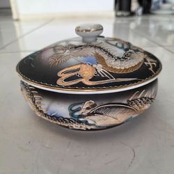 Vintage Japanese Moriage Dragonware lidded trinket dish, 6.5 inches diameter, 4 inches tall. Hand painted raised dragon relief with gold trim, black g