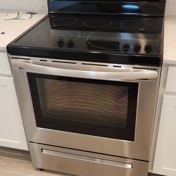 NEW FRIGIDAIRE ELECTRIC STOVE,  REFRIGERATOR AND DISHWASHER..
