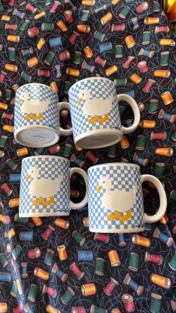 These are vintage K.I.C. coffee mugs from the 1990s