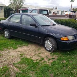 1997 Mazda Protege 1.5 Dx /106k Miles. Runs Great/gas Saver. Lots Of New Parts  .salvage title