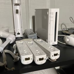 Nintendo Wii. 3 Controllers With A Bunch Of Attachments