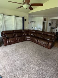 L shaped leather couch with 2 recliners