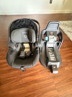Infant car seat with its base