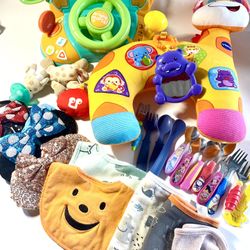 23 Piece Assorted Baby Toys Flatware Bibs Bows, Etc. 