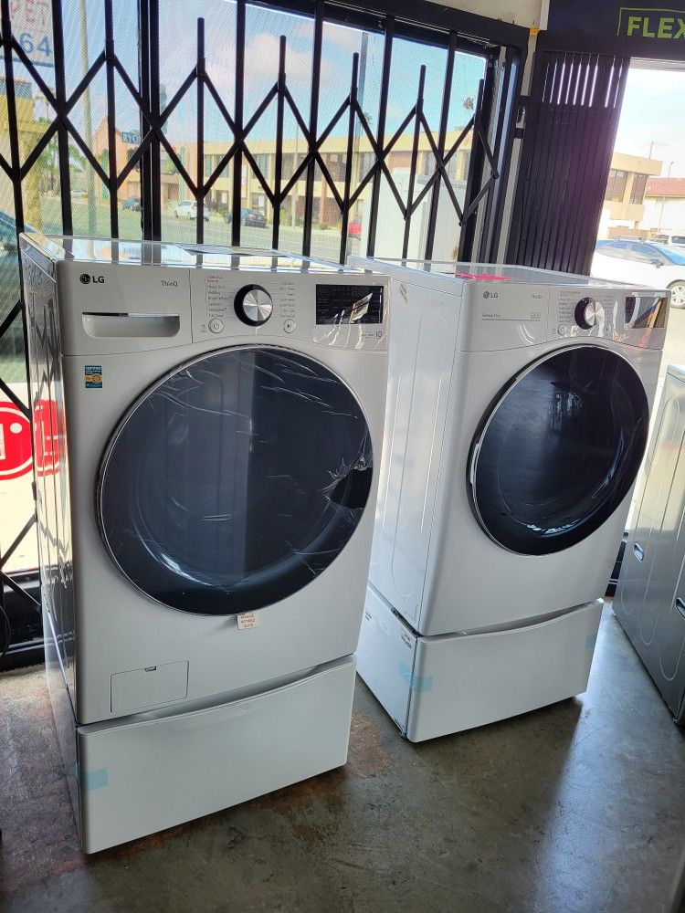 New LG ThinQ Front Load Washer 5.0 Cubic Feet & Gas Dryer 7.4 Cubic Feet With Pedestals