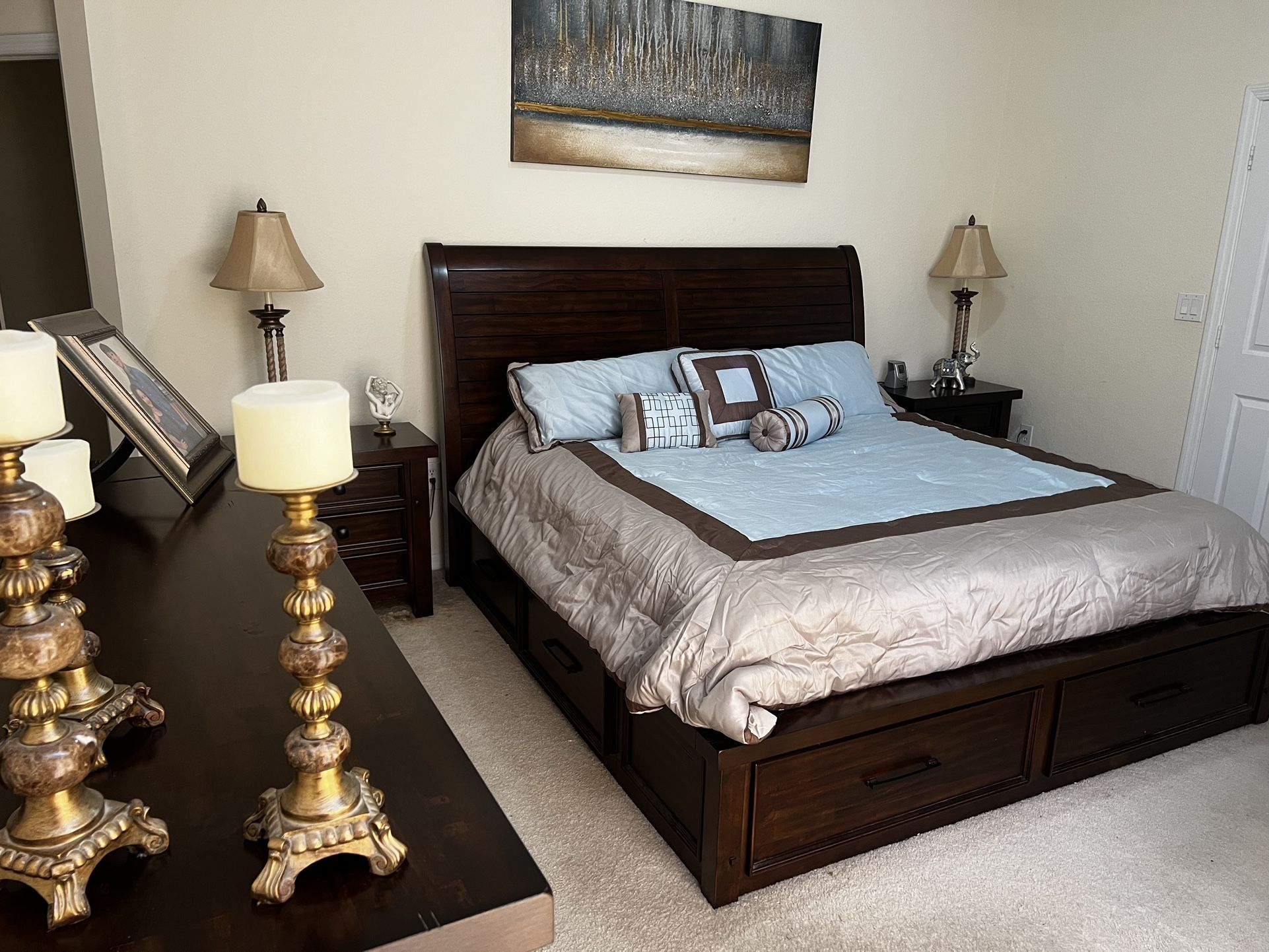 Dark wood Complete Bedroom Set. It Includes A King Size Bed with Two Side Tables, Dresser/Mirror , Entertainment Chest With Drawers, And Tall Dresser