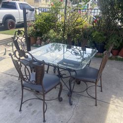 Metal And Glass Four Chair Table