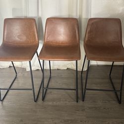 Faux leather upholstered stools