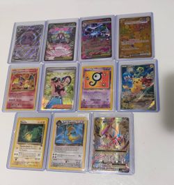 Pokemon cards near mint condition for sale Charizard, Pikachu, dark Dragonite, Perrin,