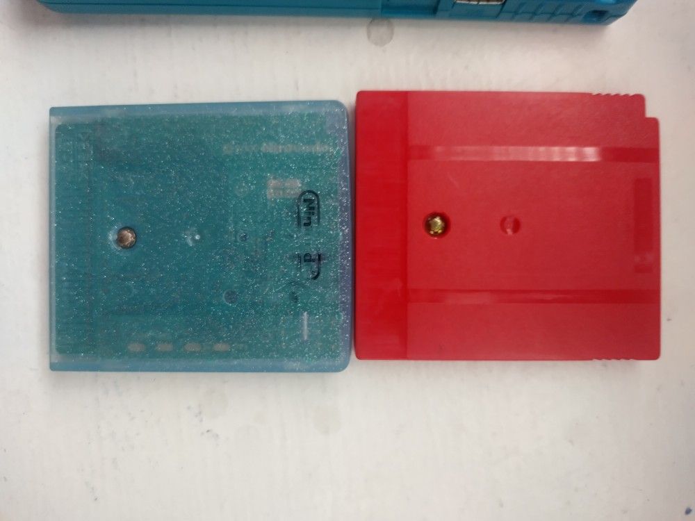A Game Boy Color And Pokemon Crystal And Pokemon Red