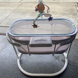 Baby beside Bassinet