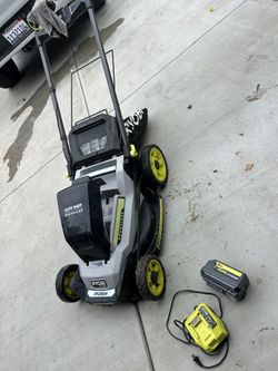 Ryobi Lawnmower With Charger And Battery 