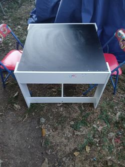 Solid Wooden Table With 2 chairs for kids 1 side is a chalkboard & the other side is for Legos we dont have no Legos at all just the table and 2 chair