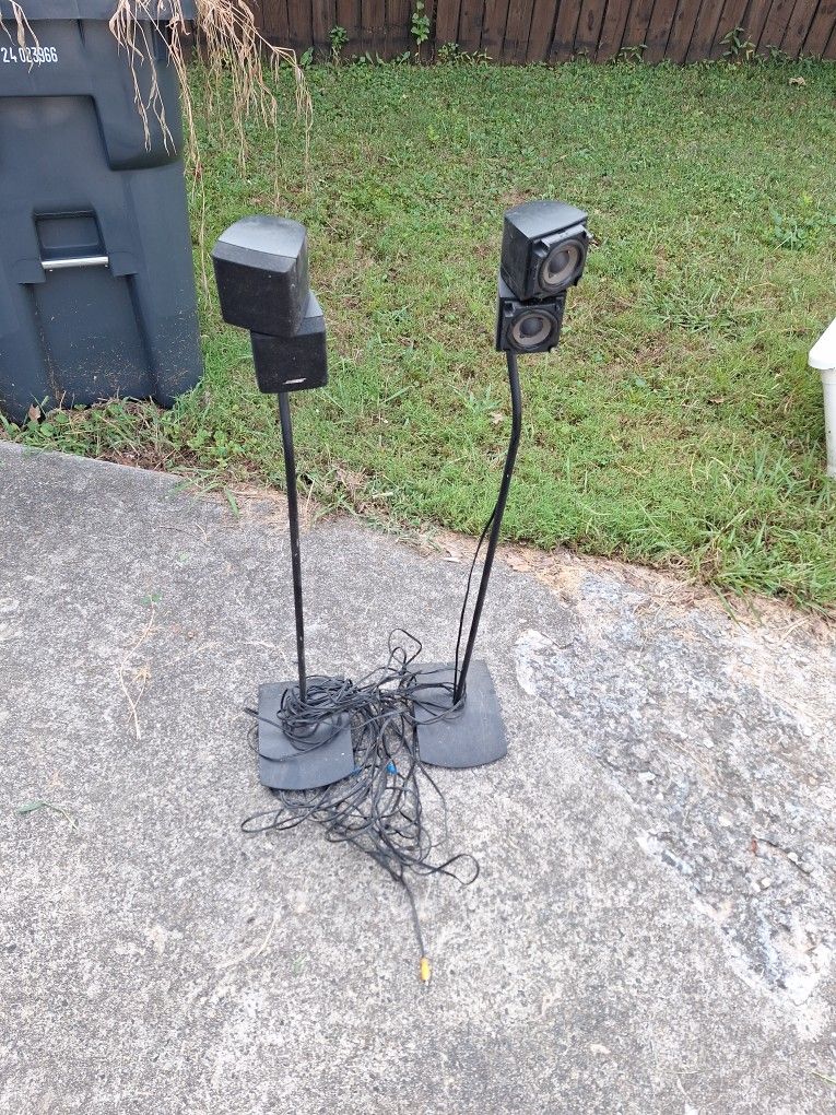 Bose speakers black with stands And to speakers without stands four speakers to all Together