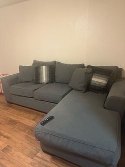 Gray sectional sofa with reversible chaise