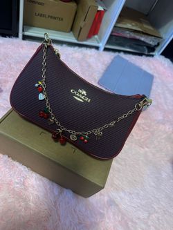 Coach handbag burgundy with cherry charm