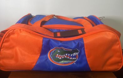 Florida Gators  Nylon Canvas Duffle Travel Bag NCAA Florida Gators Logo Gym Bag. Used in good condition with some cosmetic blemishes. These blemishes 
