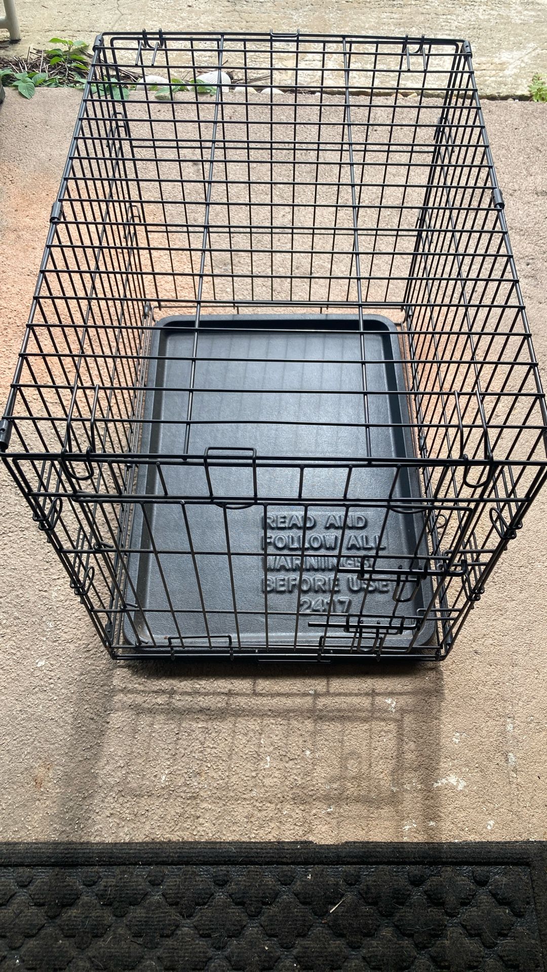 Metal dog crate. See pictures for measurements and plastic tray that’s removable.