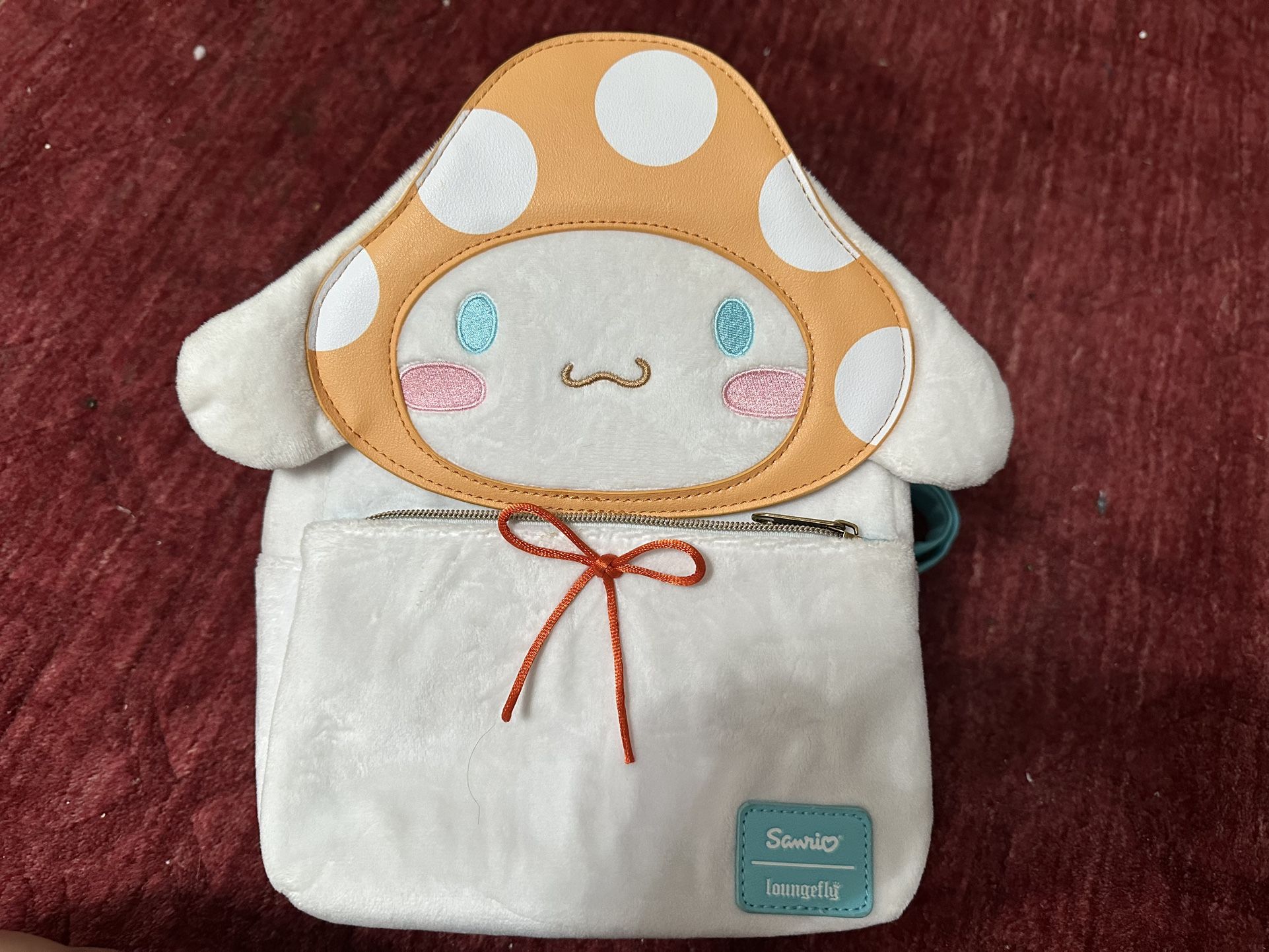 Loungefly Cinnamon roll Backpack.