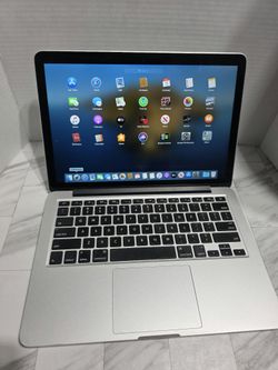 Silver aluminum MacBook Pro
i7 CORE PROCESSOR 
8GB RAM 
500GB SSD with a 13-inch Retina display, backlit keyboard, and large Force Touch trackpad. Run