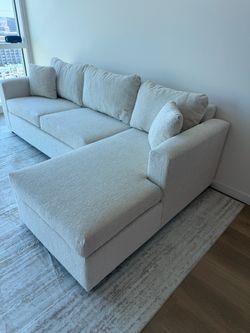 Brand new cream sectionals with free ottoman