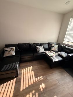 Brand new 7 piece leather sectional /ottoman