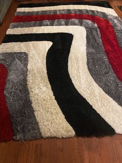 6’6 X 9’6’ RED, BLACK & WHITE SHAG RUG