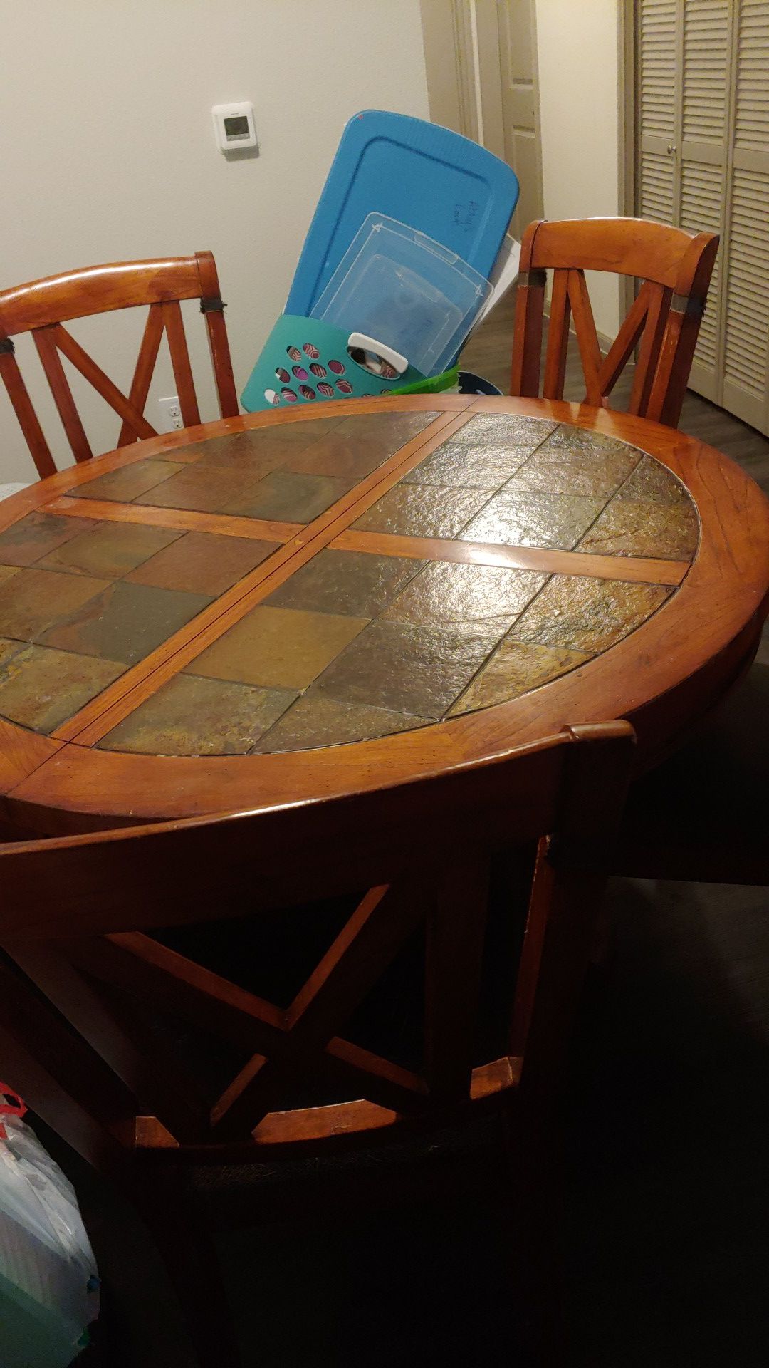 Round brown table with 5 chairs and leaf, used