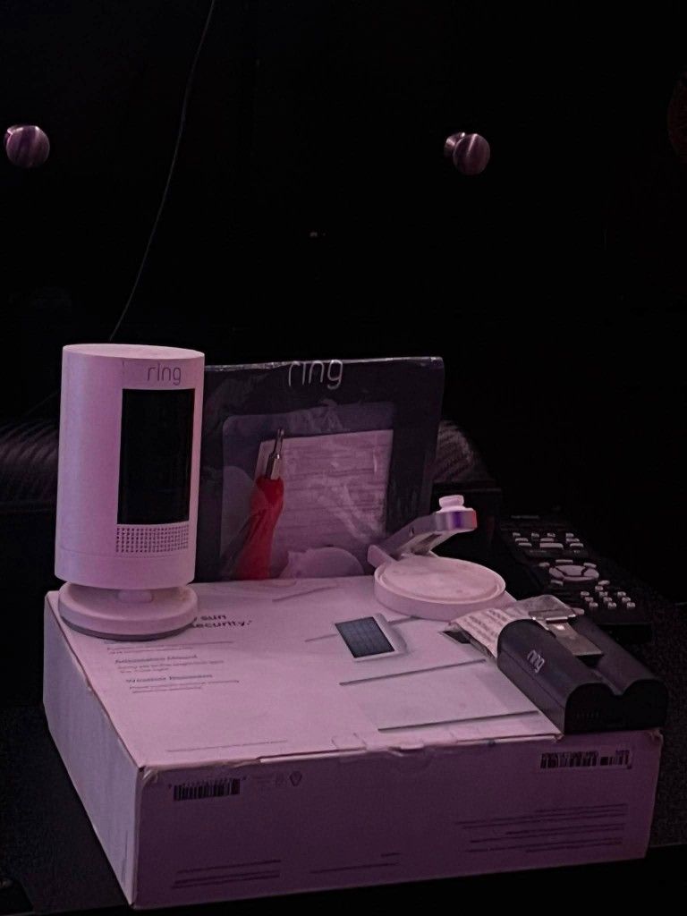 ring camera and solar panel charging with moiting brackets and hardware