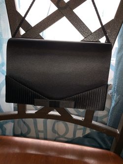Small black purse with mirror inside