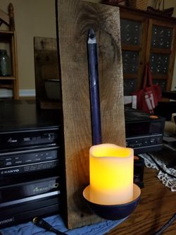 Antique metal drinking ladle candle holder