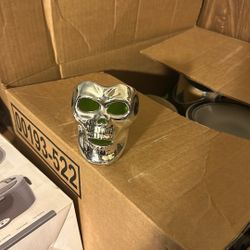 Candle Base With A Skeleton Face