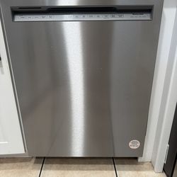 KitchenAid stainless steel dishwasher featuring top-mounted controls.