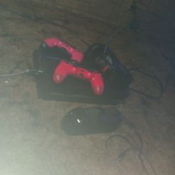 PS4 Bundle With 2 Controllers. A Headset And GTA 5 And A Dual Controller Charger Port.