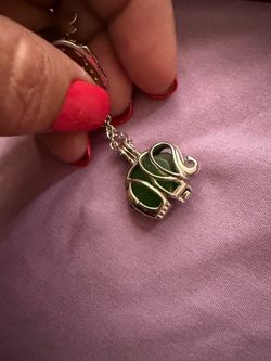 Silver Cage elephant pendant with Jade stone
