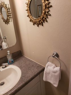 60" bathroom vanity With Formica top including mirror and toilet