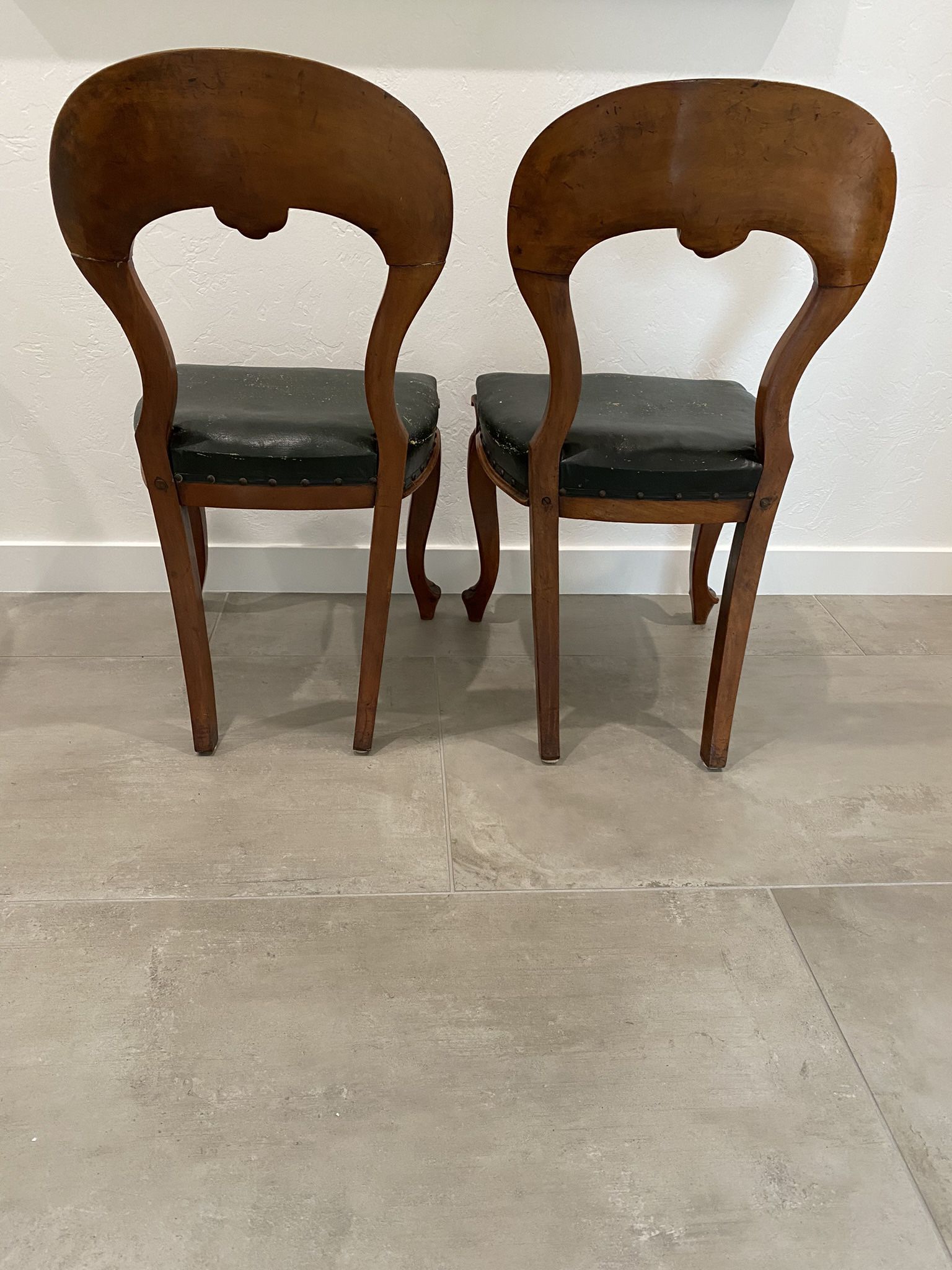 Antique chairs, leather cushions